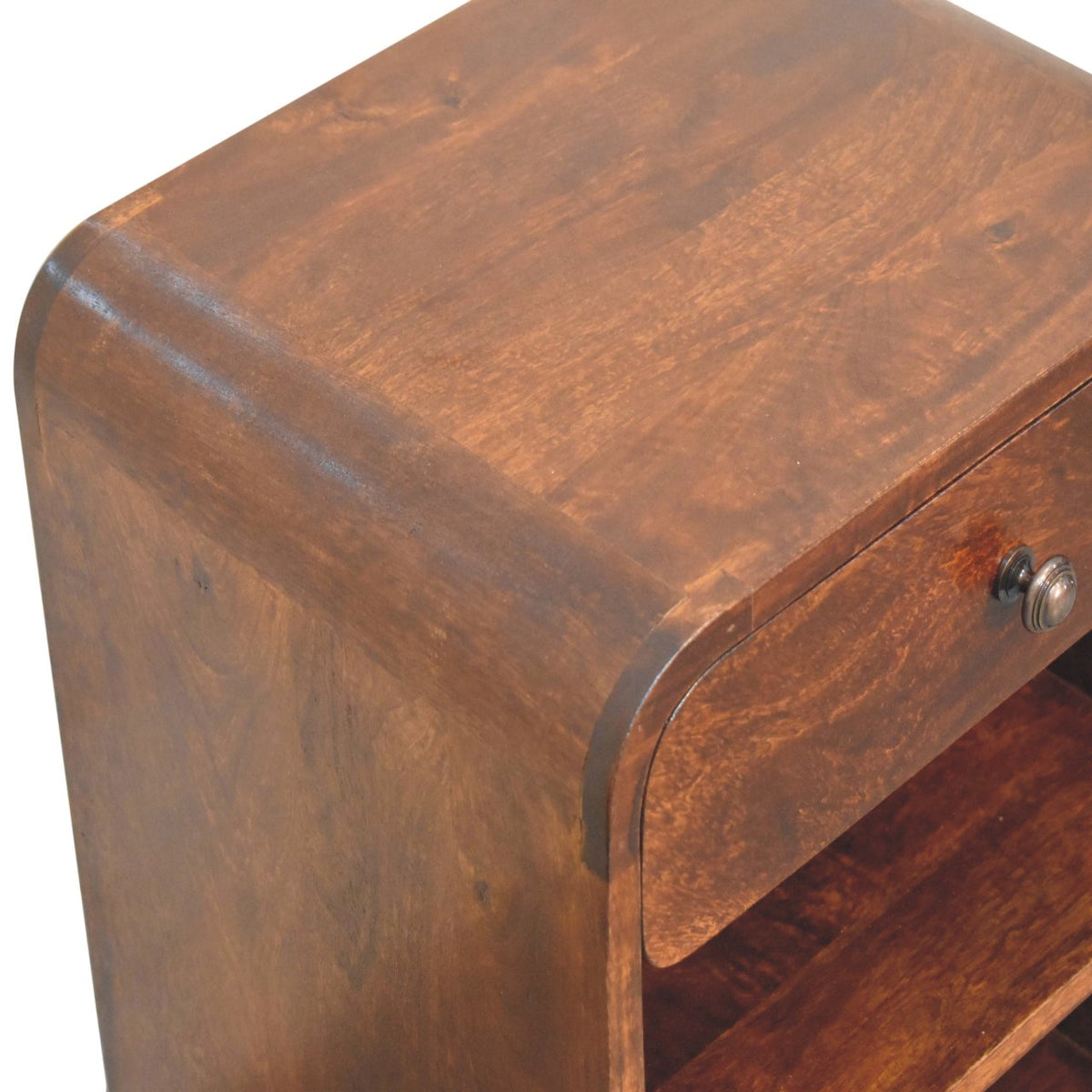 Elevated angled view showing the smooth solid mango wood top surface and rich wood grain of a chestnut finish bedside table.