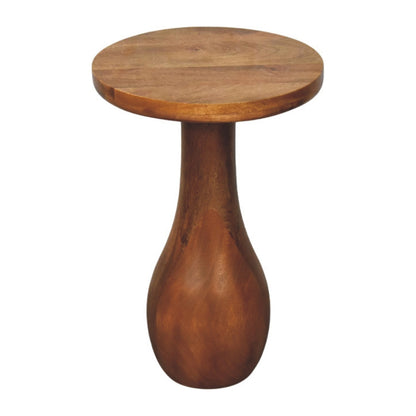 Wooden side table with a round top and tall cylindrical base on a white background
