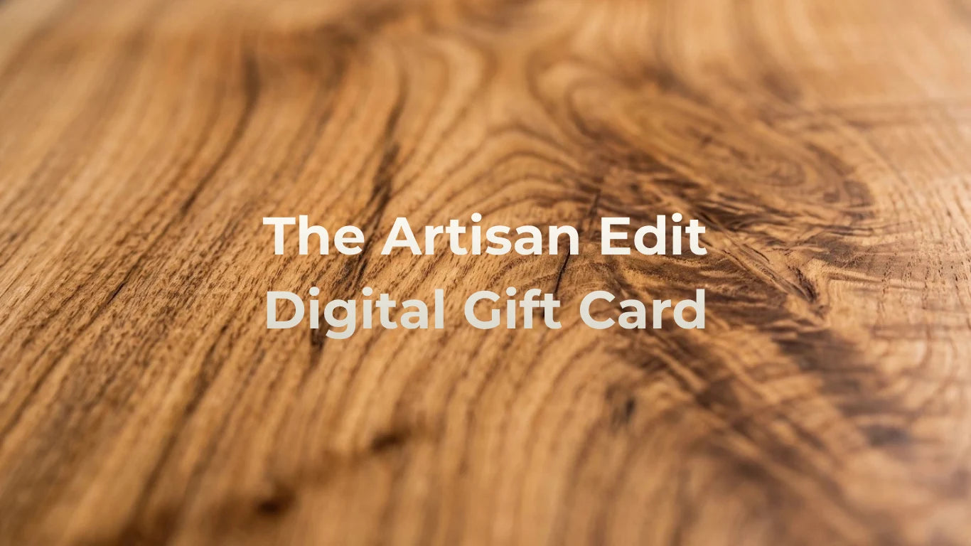 The Artisan Edit Digital Gift Card on a mango wood grain background