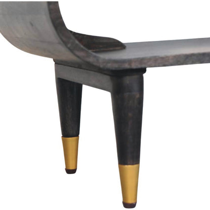 Close-up of a wooden console table in carbon ash finish with dark wooden legs and gold tips on a white background