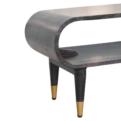 Curved media console in carbon ash finish on a white background