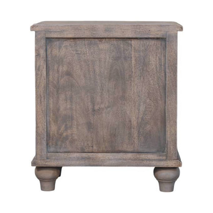 Wooden bedside table with a distressed finish on a white background