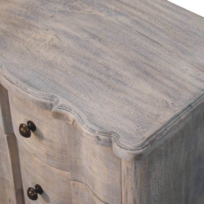 Wooden nightstand with a textured surface and metal handles on a white background
