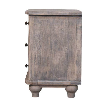 Wooden bedside table with a distressed finish on a white background