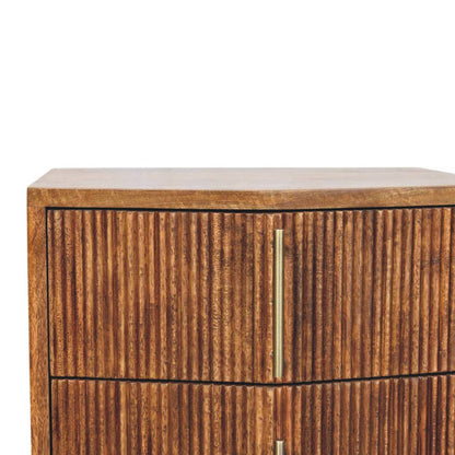 Wooden bedside table with a textured finish and a gold handle on a white background
