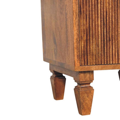 Wooden bedside table with detailed legs on a white background