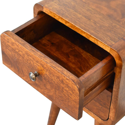 Wooden drawer unit of a nightstand with an open drawer on a white background