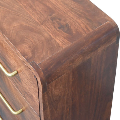 Close-up of a wooden drawer of a chest with brass handle on a white background