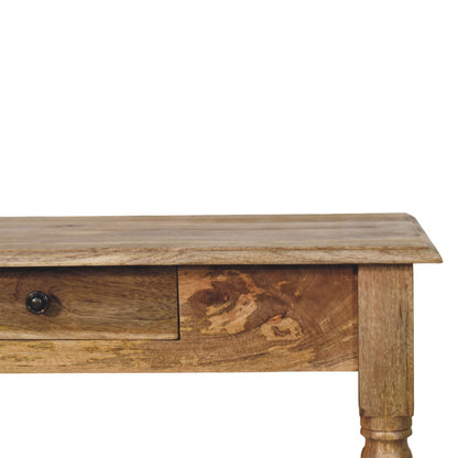Turned-leg writing desk in solid mango wood, Oak finish – front right view showing knob detail