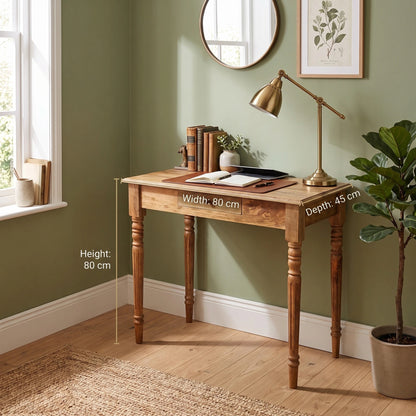 A wooden writing desk shown in a styled room corner with wall art, a lamp, books, and a potted plant. White dimension lines and text overlay indicate the desk's height:80 cm, width:80 cm, and depth:45 cm.