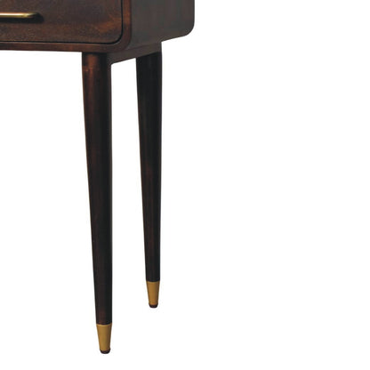Wooden leg of a console table of furniture with gold tip on a white background