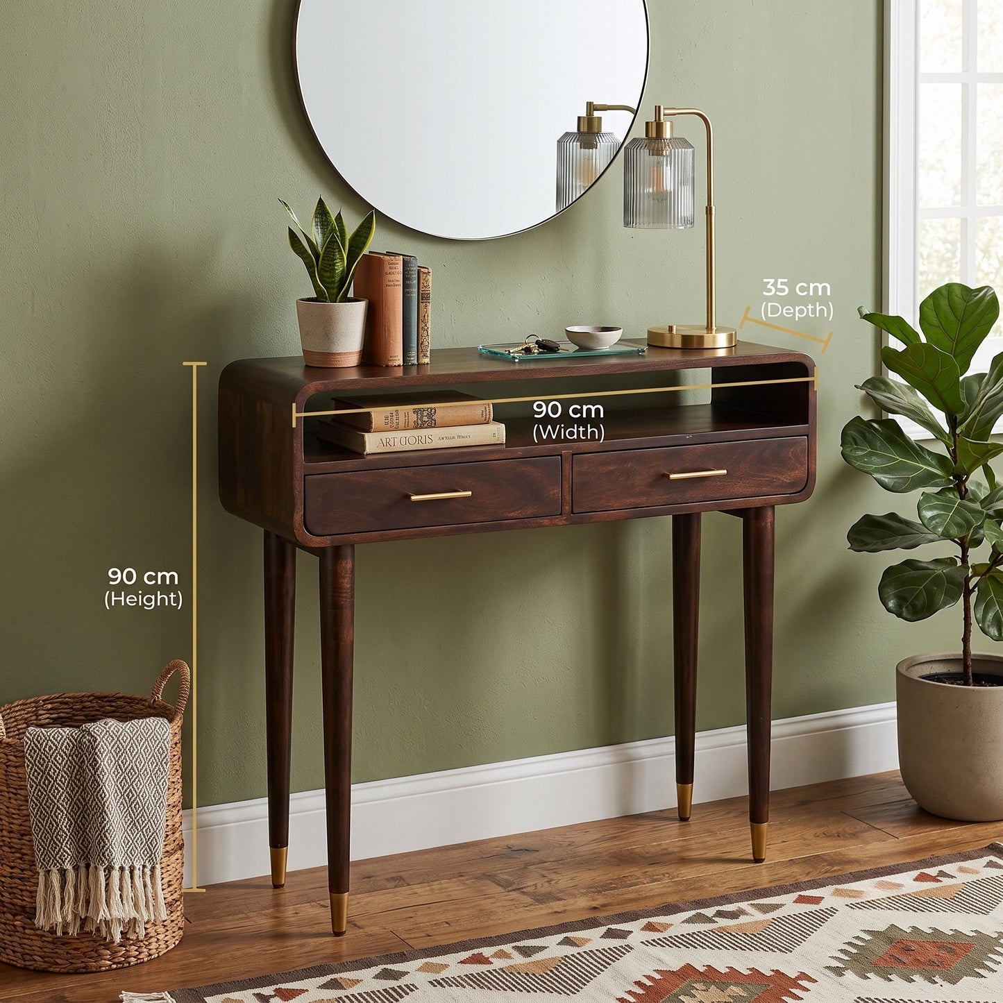 A dark wood console table with two drawers and open shelf, shown in a styled room with wall, mirror, lamp, plants, basket, and rug. White measurement callouts indicate 90 cm width, 90 cm height, and 35 cm depth.