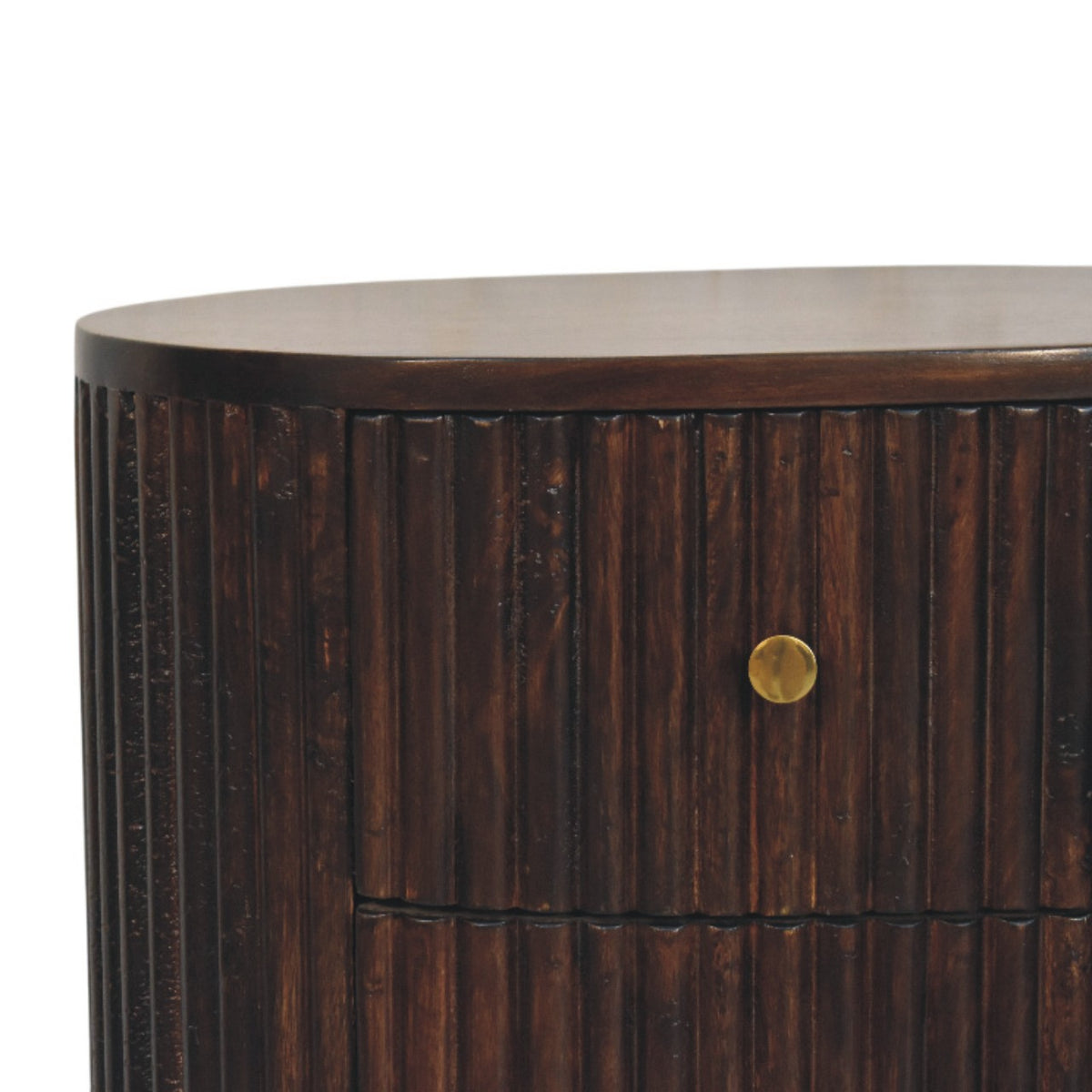 Close-up detail of a velvet mocha finish bedside table, showing the ribbed fluted wood texture, the curved top edge, and a simple brass drawer knob.