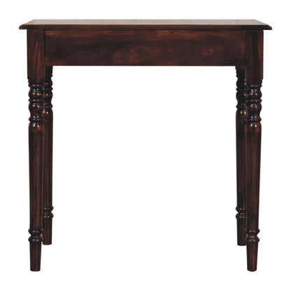 Dark wooden writing desk with turned legs on a white background
