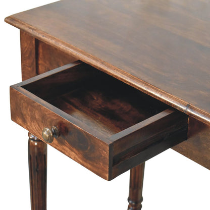 Wooden writing desk with an open drawer on a white background