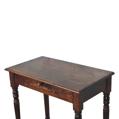 Wooden writing desk with a single drawer on a white background