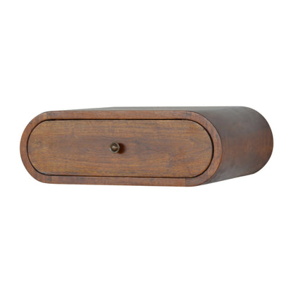 Right angle view of wall mounted round chestnut bedside table